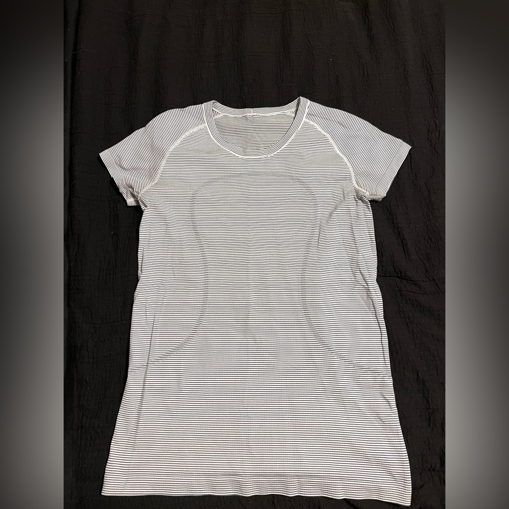 Black and white striped Lululemon swiftly tech short sleeve shirt